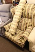 Reclining wing chair in classical striped fabric and matching long stool.
