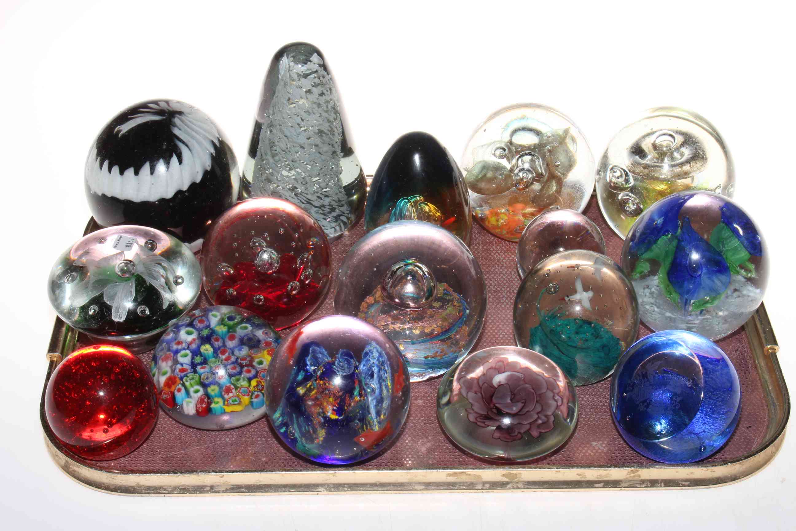 Collection of seventeen glass paperweights.