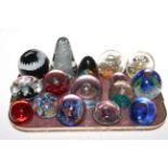 Collection of seventeen glass paperweights.