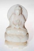 Chinese hardstone figure cross-legged on lotus leaf base, 22cm.