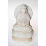 Chinese hardstone figure cross-legged on lotus leaf base, 22cm.