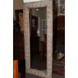 Rectangular wall mirror in moulded rustic frame, 181cm by 76cm overall.