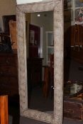 Rectangular wall mirror in moulded rustic frame, 181cm by 76cm overall.