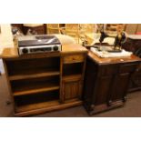 Old Charm open bookcase and vintage Jones cabinet sewing machine.