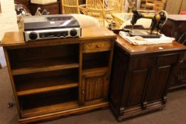 Old Charm open bookcase and vintage Jones cabinet sewing machine.