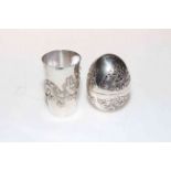 Chinese silver beaker, and egg with pierced and embossed decoration (2).