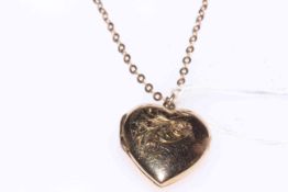 Heart shape locket on 9 carat gold chain necklace.