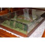 A cased military model of a battle, 102cm by 62cm by 25cm.