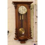 Victorian walnut Vienna double weight wall clock.