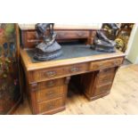 Victorian walnut desk having five drawers above a leather writing surface with two frieze drawers