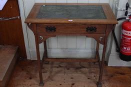 Arts & Crafts oak leather inset top writing table with frieze drawer, 75cm by 76cm.