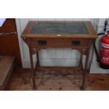 Arts & Crafts oak leather inset top writing table with frieze drawer, 75cm by 76cm.