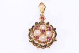 Ruby and seed pearl set 18 carat gold pendant.