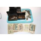 Tray lot with coinage, bank notes and vintage cash boxes.