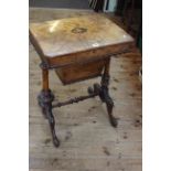 Victorian inlaid walnut sewing table raised on turned supports, 69cm by 53.5cm.