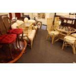 Cane conservatory furniture comprising two seater settee, chair and footstool,