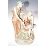 Large porcelain group of male and female water carriers in the style of Royal Dux, 57cm high.