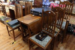 Oak gate leg dining table and six rail back chairs including pair carvers.