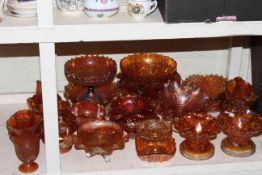 Collection of orange Carnival Glass.