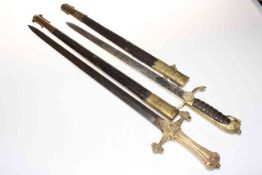 Naval short sword and scabbard and Victorian brass handled sword (2).