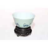 Chinese tea bowl with bat decoration on pale green celadon ground, marked to base, 9cm diameter,