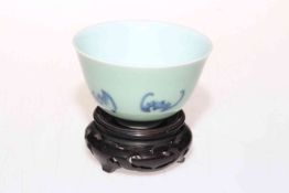 Chinese tea bowl with bat decoration on pale green celadon ground, marked to base, 9cm diameter,