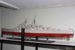 Large model of Naval battleship on stand, 195cm long.