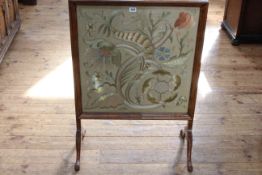 Walnut framed glazed needlework panel firescreen, 87.5cm by 62.5cm.