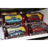 Ten boxed die-cast toy cars by Deluxe Die-cast Metal Collection.