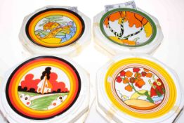 Four Wedgwood Clarice Cliff design plates.