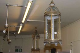 Pair of six panelled glazed gilt metal cylindrical dome topped hanging hall lanterns.