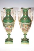 Pair of urn shaped vases with winged maiden handles, decorated with floral panels,