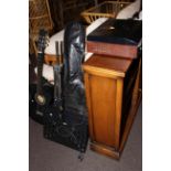 Two vintage guitars, music stand and turntable radio.