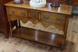 Period style oak three drawer potboard dresser, 76.5cm by 118cm.