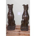 Pair of seated pointer dogs, 78cm.