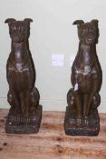 Pair of seated pointer dogs, 78cm.