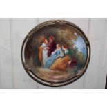 19th Century pottery plaque decorated with classical figures on ornate brass mount.