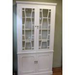 Painted four door cabinet bookcase, 202cm by 103cm.