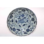 Chinese blue and white glazed stoneware dish with exotic bird and foliage decoration,