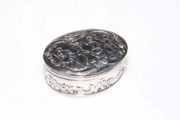 Dutch silver oval box embossed with figures and scrolls,