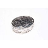 Dutch silver oval box embossed with figures and scrolls,
