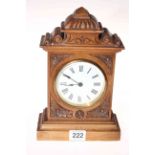 Late Victorian carved walnut cased mantel clock, 24cm.