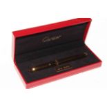 Cartier 'Serie Limitee' black and gold fountain pen, with box and papers.