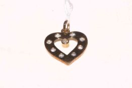 Nine stone diamond set 9 carat gold heart shaped pendant.