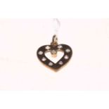 Nine stone diamond set 9 carat gold heart shaped pendant.