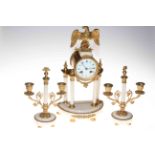 Gilt metal and onyx three piece clock garniture,