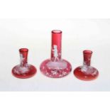 Garniture of three Victorian ruby glass Mary Gregory vases.