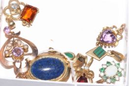 Collection of eight gem set pendants, mostly 9 carat gold.