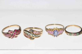 Four 9 carat gold gem set rings.