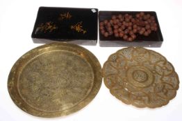 Oriental lacquered box and beads, Islamic circular dish and another with and inscription,